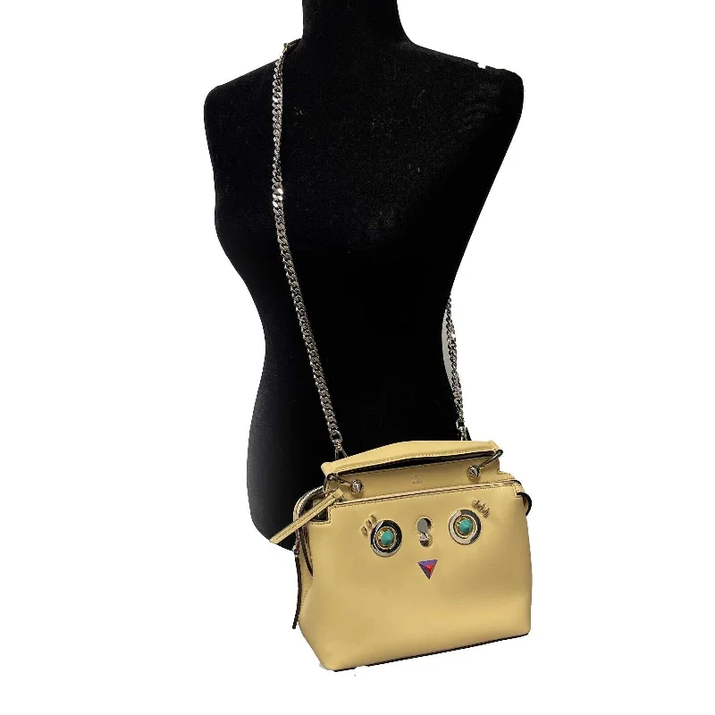 Fendi Baguette bags with a detachable charm featuring the brand's mascotFENDI -DotCom Faces Convertible Small Yellow Satchel - Top Handle w/ Chain Strap