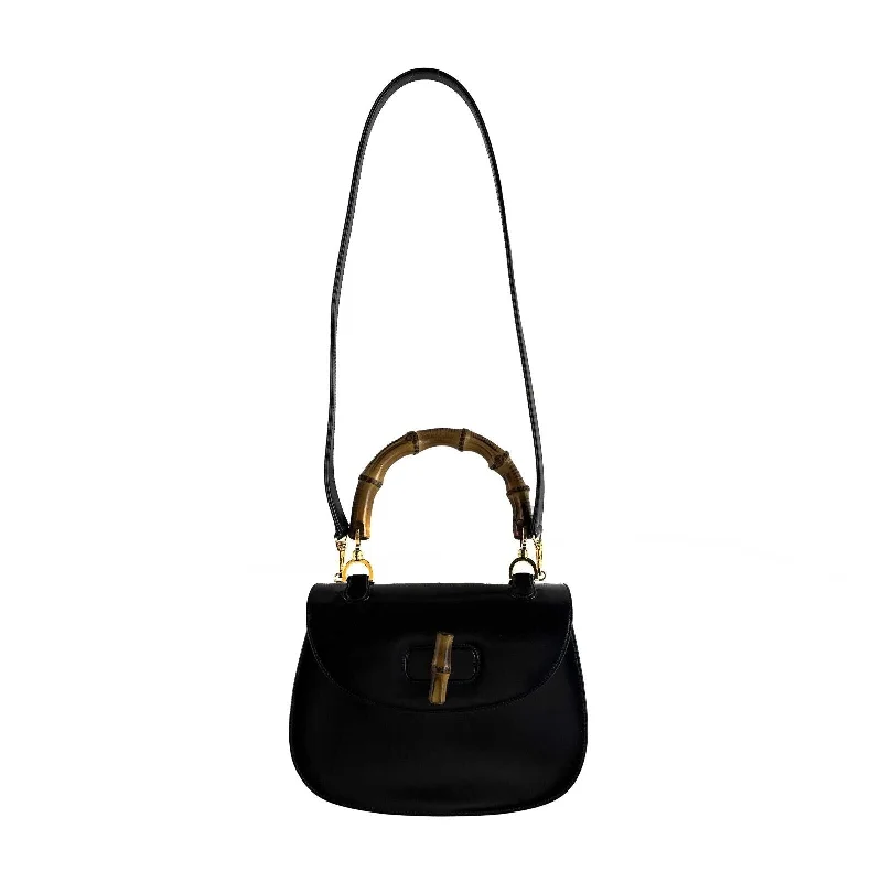 Women Gucci Sylvie bags with a monogram - embossed leatherGUCCI Vintage Bamboo Night Handle Black shoulder crossbody bag