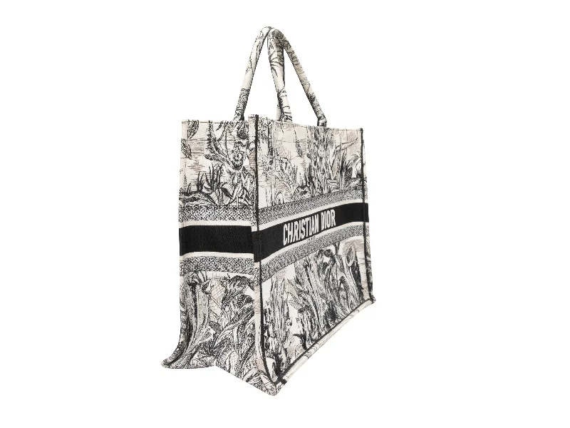 Christian Dior Saddle bags with a studded trim for a bold lookWhite & Black Christian Dior Large Toile de Jouy Book Tote