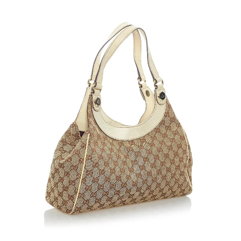 Women Gucci Sylvie bags with a monogram - embossed leatherGucci GG Canvas Charmy Shoulder Bag (32800)