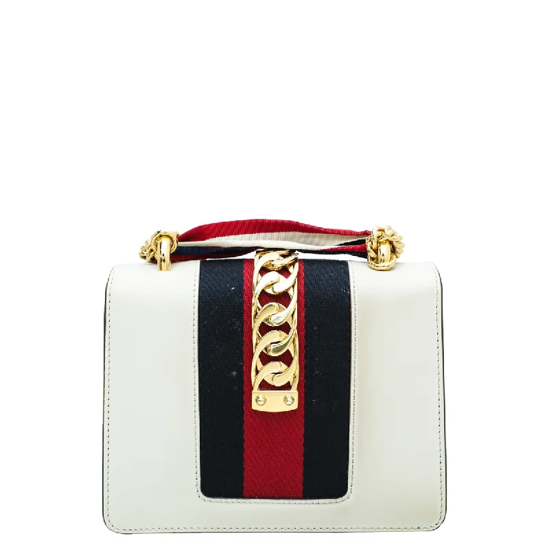 Women Gucci Sylvie bags featuring the signature web stripeGucci White Sylvie Mini Flap Chain Bag