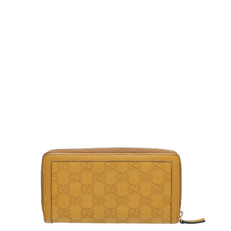 Gucci Marmont bags for women with a contrast - colored interiorGucci Mustard GG Guccissima Sukey Zip Around Wallet