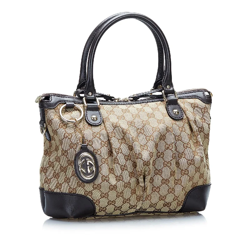 Women Gucci Sylvie bags with a monogram - embossed leatherGucci GG Canvas Sukey Satchel (SHG-eP2ZCC)