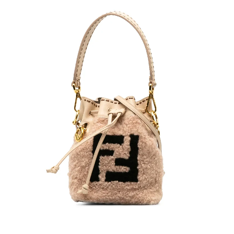 Fendi Baguette bags featuring the iconic FF logo plaque for a branded lookPink Fendi Shearling Mini Mon Tresor Bucket Bag